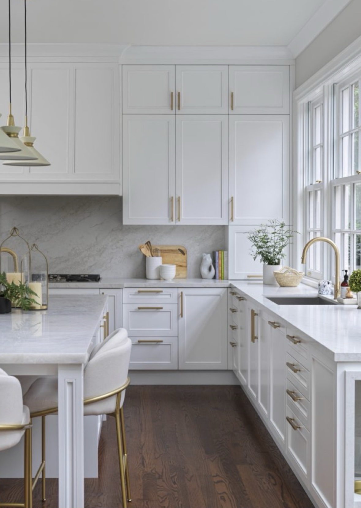 Custom white kitchen remodel with brass fixtures by Atlantic Custom Homes