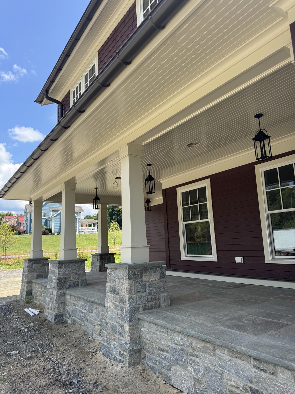 Construction management project with stone porch columns