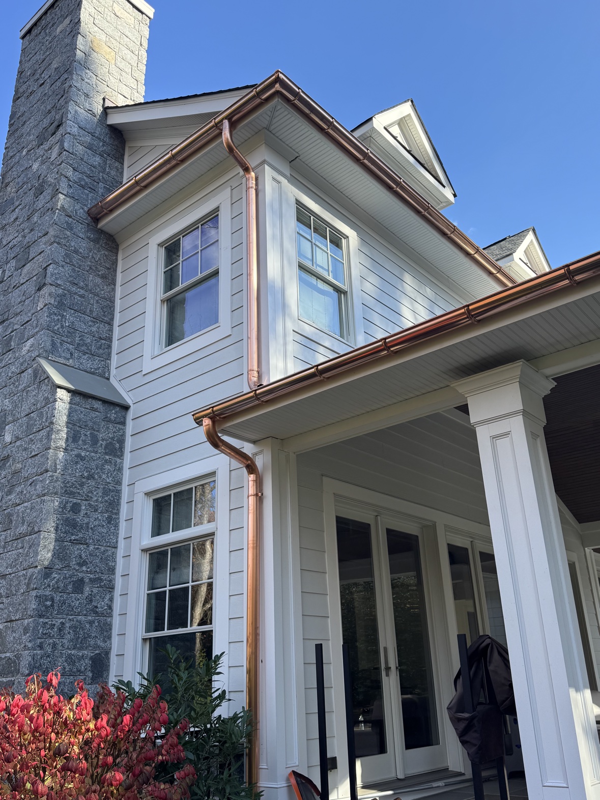 White home with copper chimney flashing